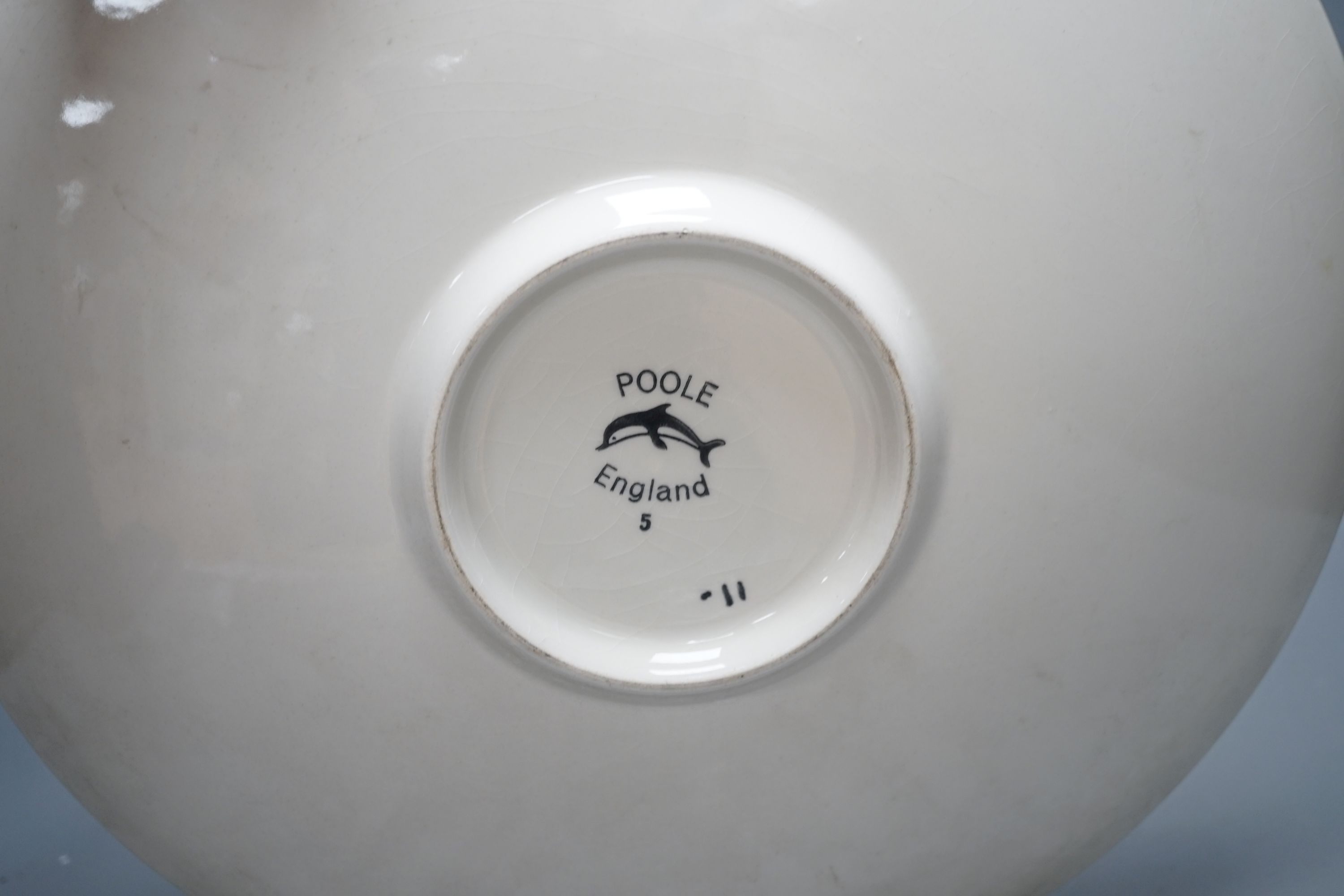 A Poole pottery orange Delphis designed charger-36 cms diameter.